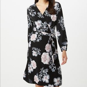 Mock wrap knee length dress. 95% poly 5% spandex.